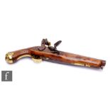 A 19th Century flintlock holster pistol, 21cm barrel, tower mark, brass trigger guard and butt.