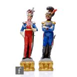Two Italian Naples models of soldiers, one in a red uniform, the other blue, both with painted