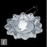 A 19th Century clear crystal portrait medallion of star shape, internally decorated with a profile