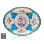 An early 20th Century oval dish in the manner of Sevres, decorated with a hand painted cherub