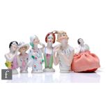 A collection of Art Deco porcelain half dolls, all of varying designs similarly decorated and picked