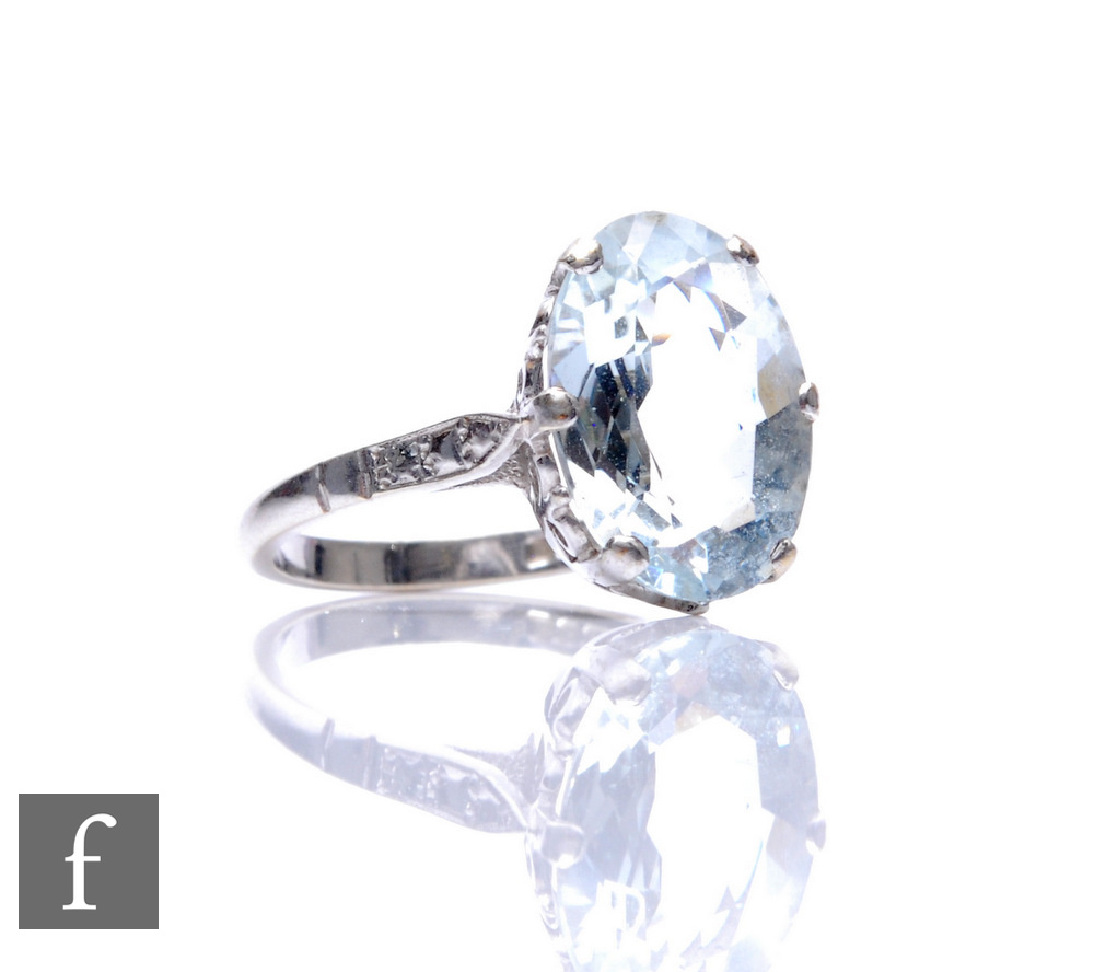 A 9ct hallmarked white gold single stone aquamarine ring, claw set oval stone length 14mm, weight