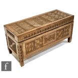 An African hardwood linen or blanket chest, carved overall with geometric patterned panels and