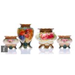 Two Royal Worcester vases comprising a shape H261 four footed vase decorated by B. Cox with hand