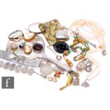 A small parcel lot of assorted costume jewellery to include beads, earrings. a silver backed hand