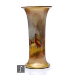 A large Royal Worcester trumpet vase, shape G923, hand painted by James Stinton with pheasant to a