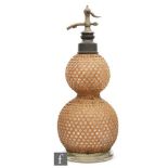An early 20th Century French soda siphon of double gourd form with wicker work cover, inscribed
