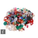 A parcel lot of loose cut and polished agate stones to include moss agate, carnelian etc with a
