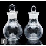 A pair of late 18th Century clear crystal tea caddies of ovoid form with hollow diamond facet cut