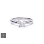 A platinum set diamond solitaire ring, princess cut claw set stone, weight 0.54ct, colour F/G.