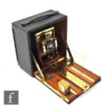 A late Victorian Century Camera co. half plate mahogany and brass field camera,