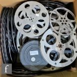 A collection of empty metal film reels, sizes vary, largest diameter 66cm. (33)