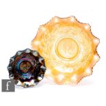 Two early 20th Century Carnival glass bowls by Crown Crystal, each relief moulded to the central