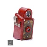 A Coronet Midget Sub-Miniature camera by The Coronet Camera Co, circa 1937, the Bakelite body in red