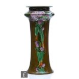 An early 20th Century Doulton Lambeth vase, decorated by Margaret Thompson with panels of purple