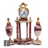 A 20th Century French clock gilt mounted garniture, the movement on a four pillar base with two side