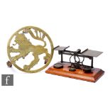 A set of early 20th Century brass postal scales and weights and a brass trivet of rampant lion