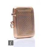 A 9ct hallmarked cushioned rectangular vesta case, weight 27g, with engine turned decoration, London