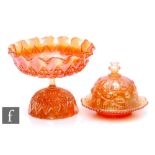 Two pieces of early 20th Century carnival glass, a fruit bowl and base by Sowerby, relief moulded in