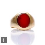 A 9ct hallmarked single stone signet ring set with an oval carnelian, weight 7.3g, ring size N 1/2.