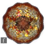 An early 20th Century Carnival glass footed bowl by Millersburg, relief moulded to the central