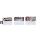 Three early 20th Century silver hinged bangles to include two buckle examples, each with engraved