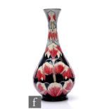 A large Moorcroft Pottery bottle vase decorated in the Desert Ivory pattern designed by Anji