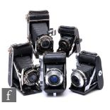 A collection of 1930s folding cameras, to include Prontor, Prontor II, two Baldax Prontor-SVS and