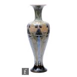 A Doulton Lambeth vase designed by Eliza Simmance, of footed ovoid form with a flared neck, with