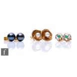 Three pairs of assorted 9ct stud earrings, one emerald and diamond, the other two with cultured