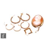 A 9ct hallmarked mounted cameo brooch, weight 9g, with two pair of 9ct hoop earrings and two 9ct odd