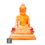 An early 20th Century Carnival glass figure formed as Buddha, unknown maker, in marigold, height