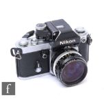 A Nikon F2 Photomic SLR Camera, with chrome body, serial No. F27827442, with 3.5b f28mm, serial