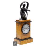 An early 19th Century French Empire mantle clock with eight day movement striking on a bell, the