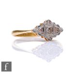 An early 20th Century 18ct diamond ring comprising four diamonds to a platinum flat head, weight 2.