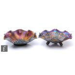 Two early 20th Century Carnival glass bowls by Northwood, the first a three footed bowl with