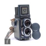 A 1957 Rollei Baby Rolleiflex Grey 4x4 TLR Camera, serial number 2056028, with Schneider Xenar f/3.5