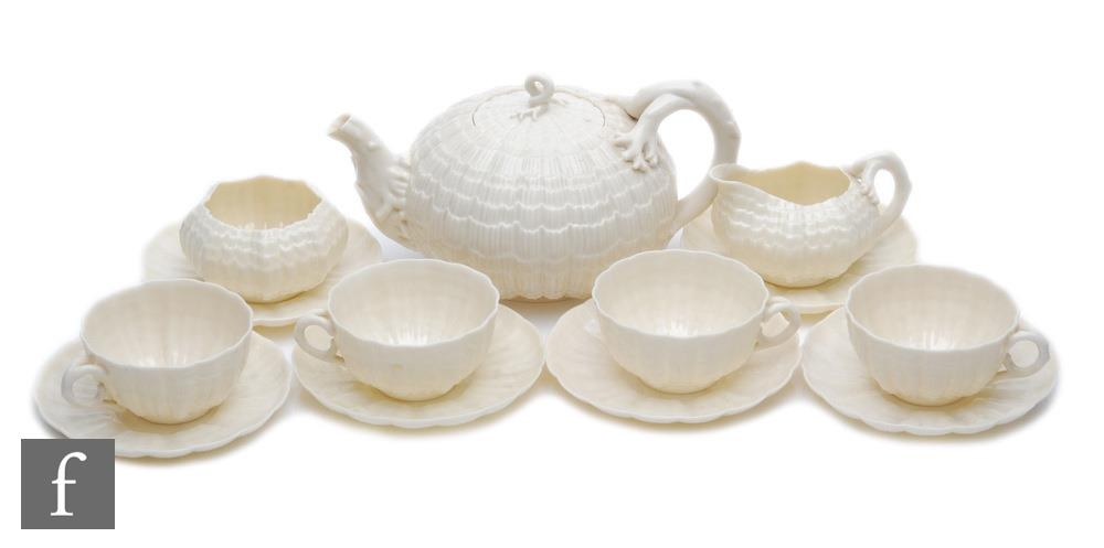 A late 19th Century First Period Belleek Nautilus shape part teaset comprising teapot, milk jug,