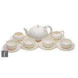 A late 19th Century First Period Belleek Nautilus shape part teaset comprising teapot, milk jug,