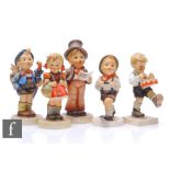 A small collection of 20th Century M.J.Hummel figures, modelled as children walking and playing