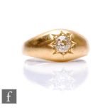 An early 20th Century 18ct diamond solitaire ring, gypsy set, old cut stone, weight approximately