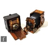An early 20th Century Sanderson Tropical model, brass and mahogany half plate camera with black