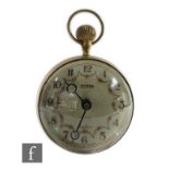 A 20th Century brass bullseye clock with spring driven movement, diameter 11cm.