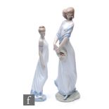 A large Lladro figure titled Romantica, number 6805, modelled as a lady in flowing gown with a