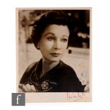 A signed 8 x 10 inch black and white photograph of Vivien Leigh, signed in black ink on the lower