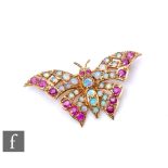 A modern 9ct hallmarked brooch modelled as a butterfly and set with opals and rubies, weight 4.8g,