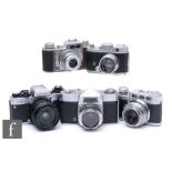 A collection of 35mm cameras to include a Rolleiflex SL35E, a Apparate & Kamerabau AkArette