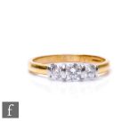 An 18ct hallmarked diamond three stone ring, brilliant cut stones, total weight 0.50ct, to plain