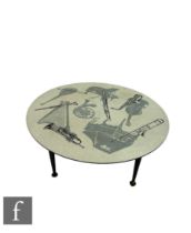 Unknown maker - In the manner of Piero Fornasetti - A 1950s laminated coffee table of circular form,