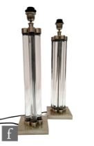 Eichholtz - A pair of Art Deco style table lamps, the square plinth chrome base rising to a series